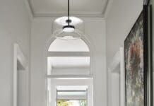 Blue see-through hallway table in entry of Bluestone Sanctuary by The Stylesmiths