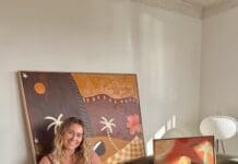 Britney Turner with some of her artworks