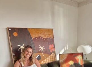 Britney Turner with some of her artworks