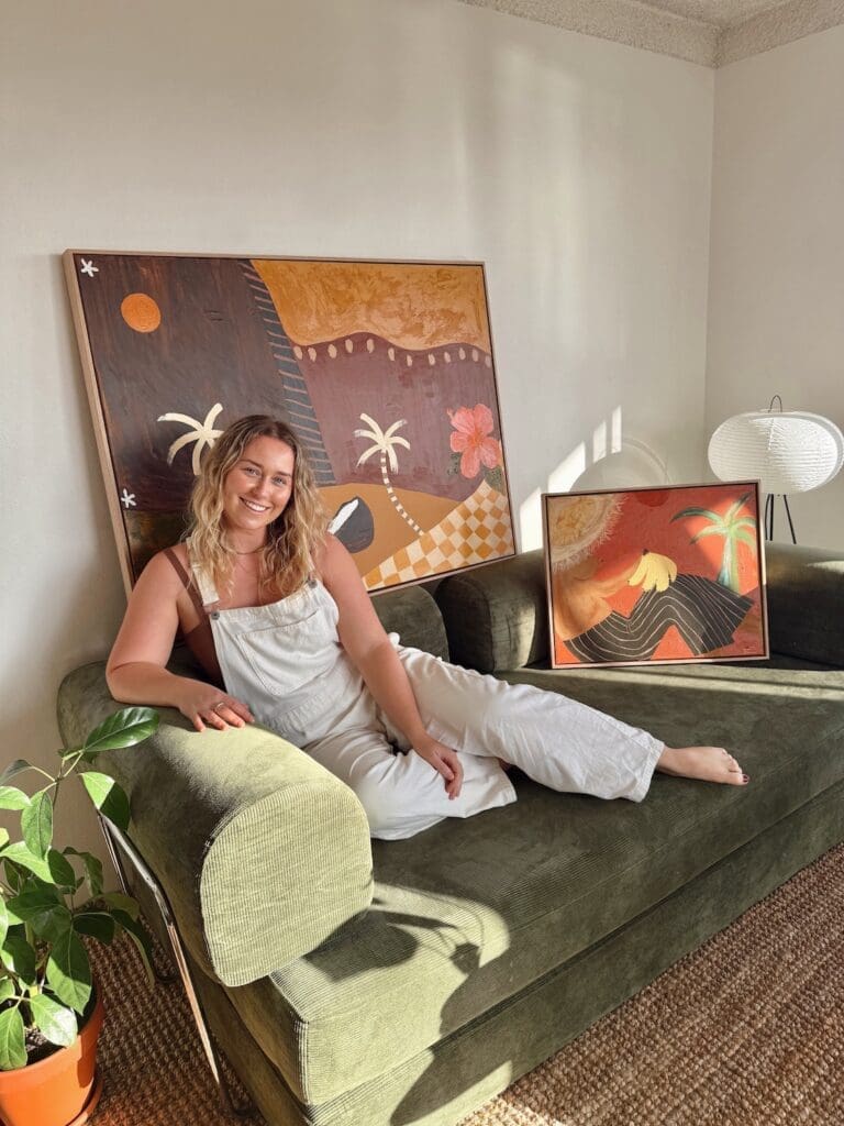Britney Turner with some of her artworks