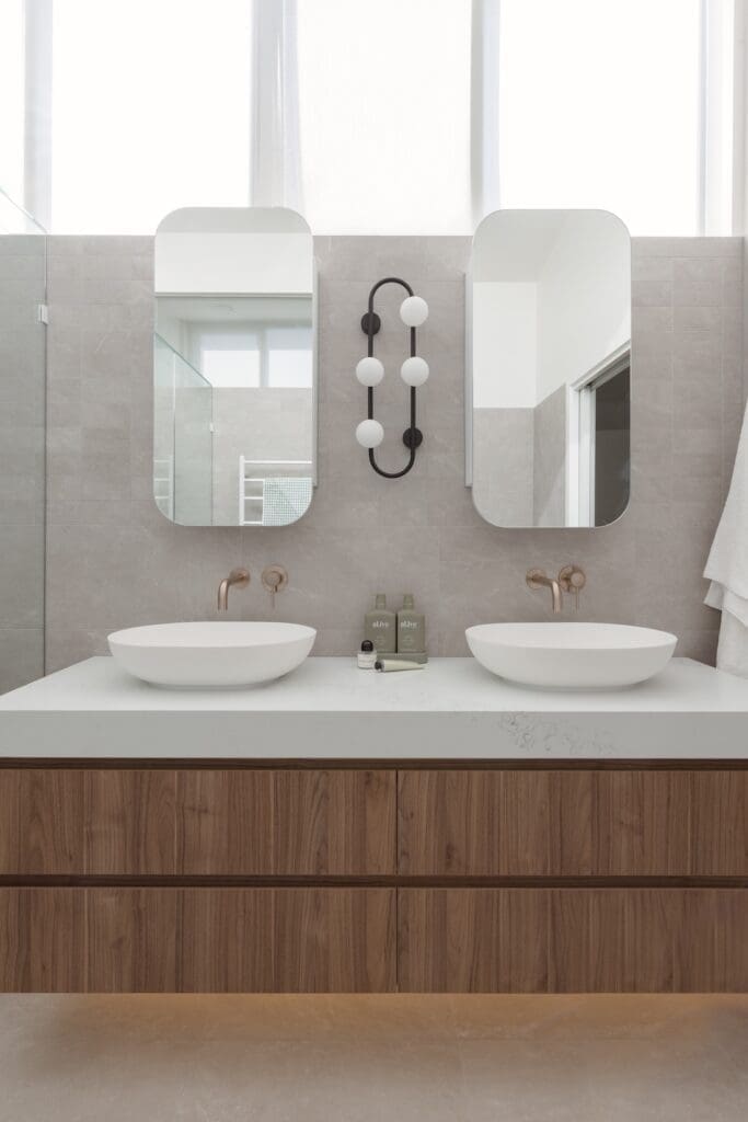 Double vanity with stadium mirror shaving cabinets