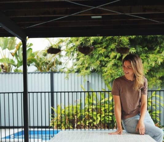 Gina sitting on table