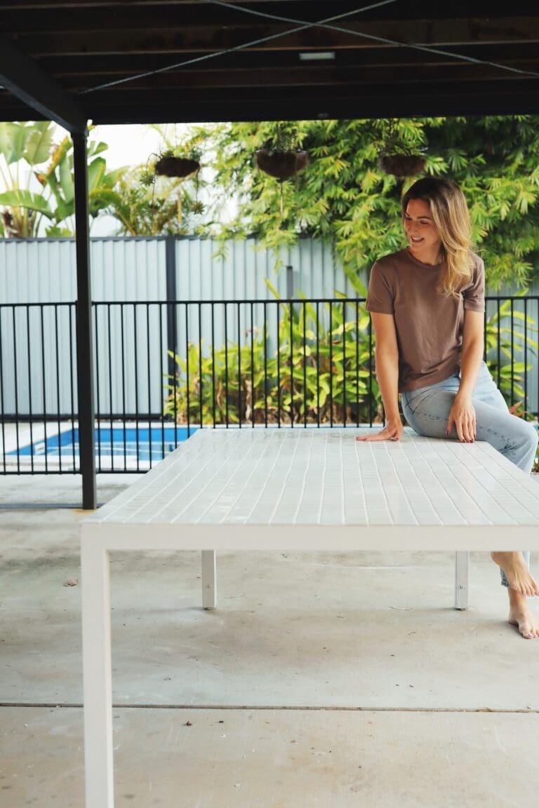 Gina sitting on table