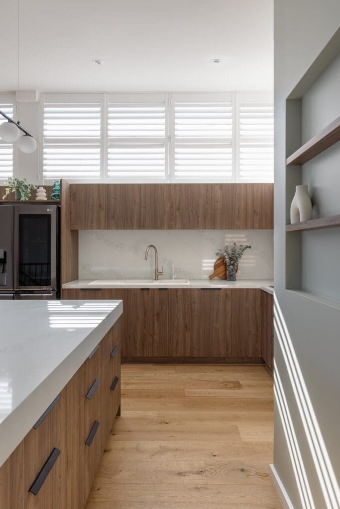 High windows with shutters in kitchen