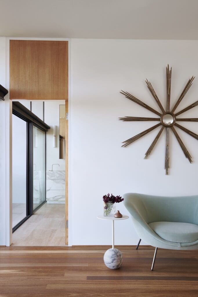 Star burst brass sculpture on wall of master bedroom in Meller House