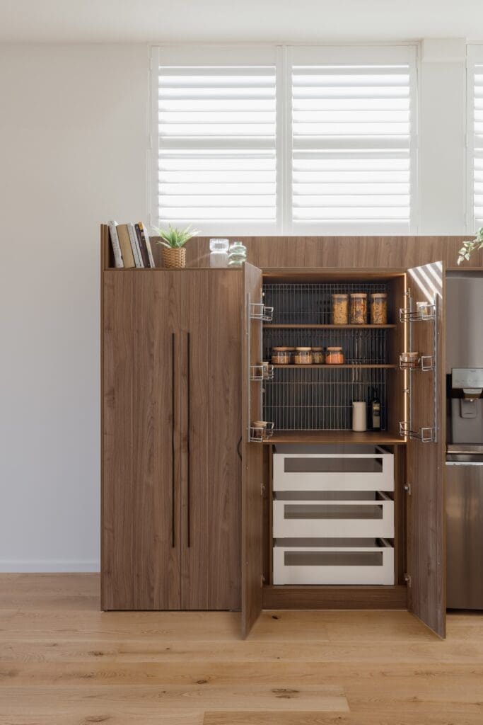 Tiled back in appliance cupboard