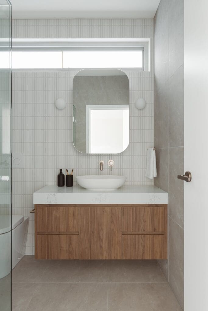 White kitkat tile bathroom feature wall