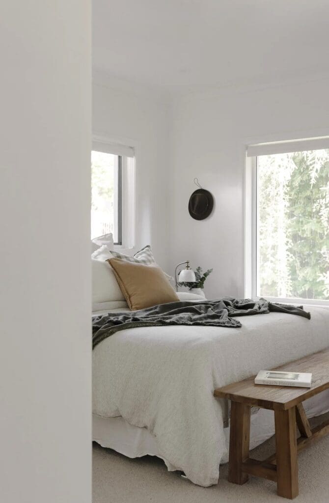 Bedroom with simple elegant styling at Ewingsdale home