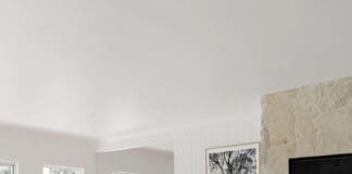 Living room with fireplace at Ewingsdale home