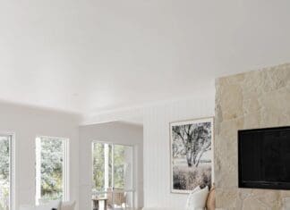 A glimpse inside a glorious modern Australian farmhouse Living room with fireplace at Ewingsdale home