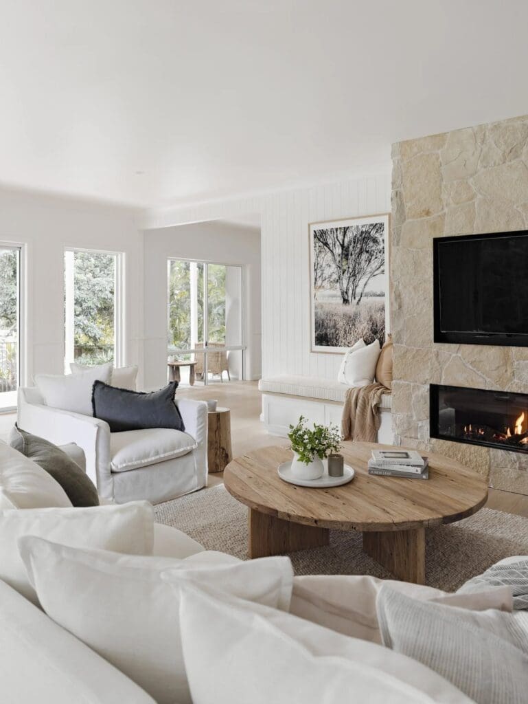 Living room with fireplace at Ewingsdale home