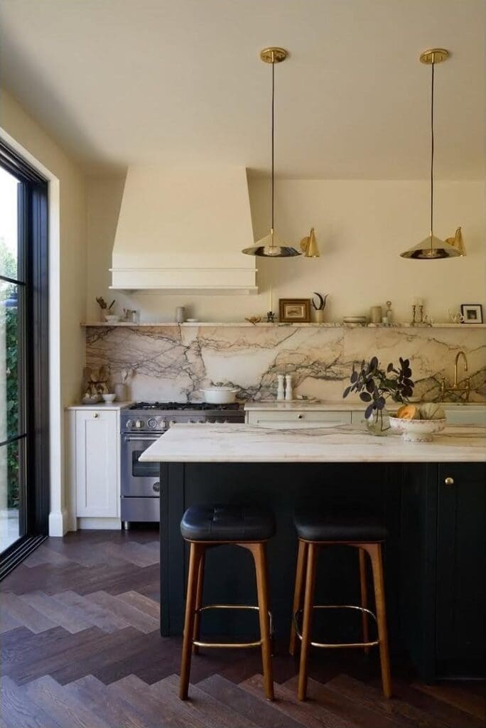 Marble kitchen renovation black island and herringbone floors