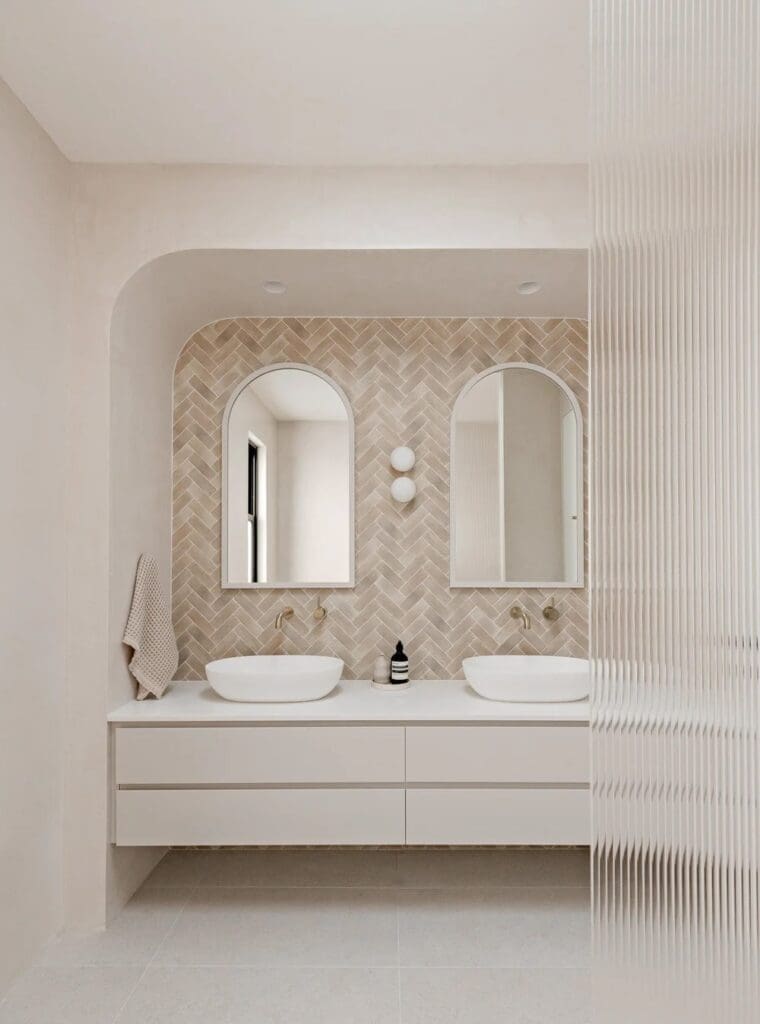 Bathroom with double vanity and reeded glass at The Stables Burraneer House