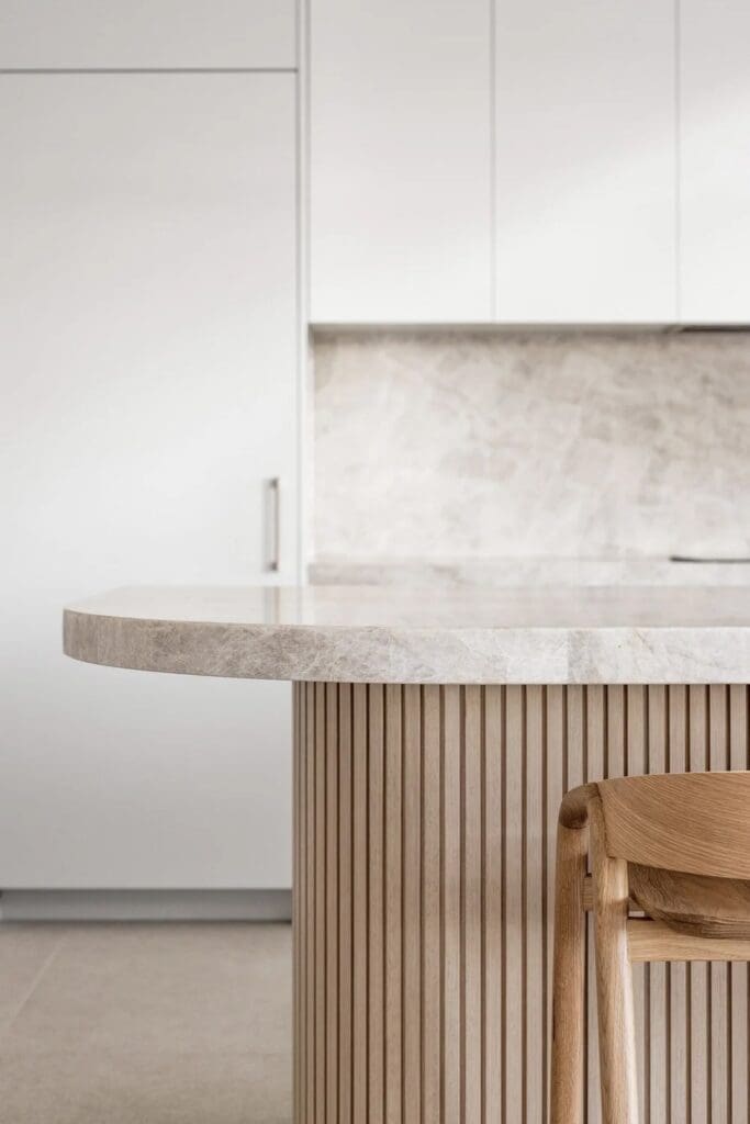 Fluted stone and Taj Mahal top of island bench at The Stables Burraneer House