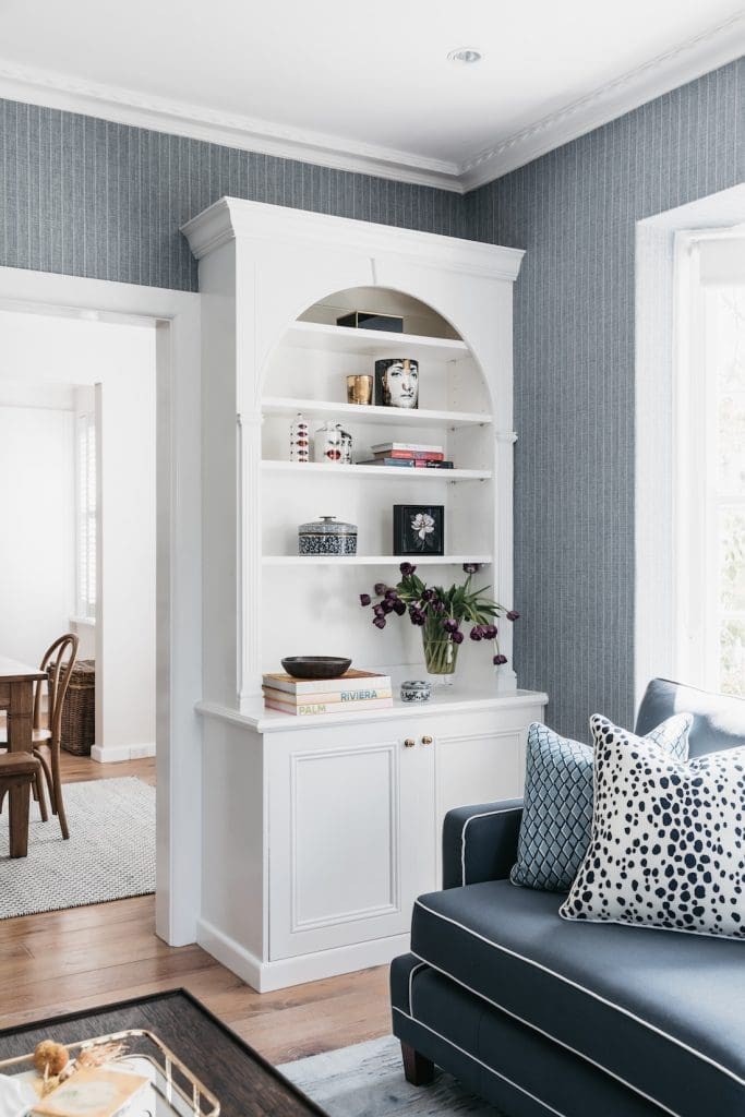 Arched bookcase in living space at Patterned Sanctuary by The Stylesmiths