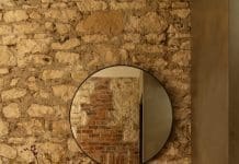 Coastal alchemy: Inside a heritage Sorrento retreat Exposed limestone brick wall in bathroom at Coastal Alchemy by The Stylesmiths