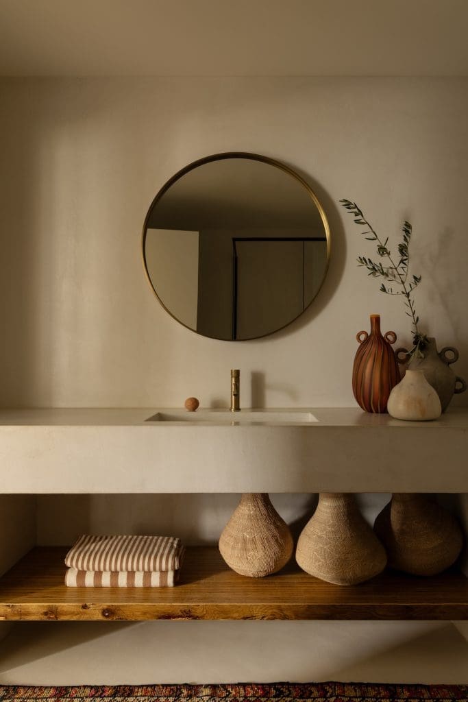 Bathroom with stone vanity at Coastal Alchemy by The Stylesmiths