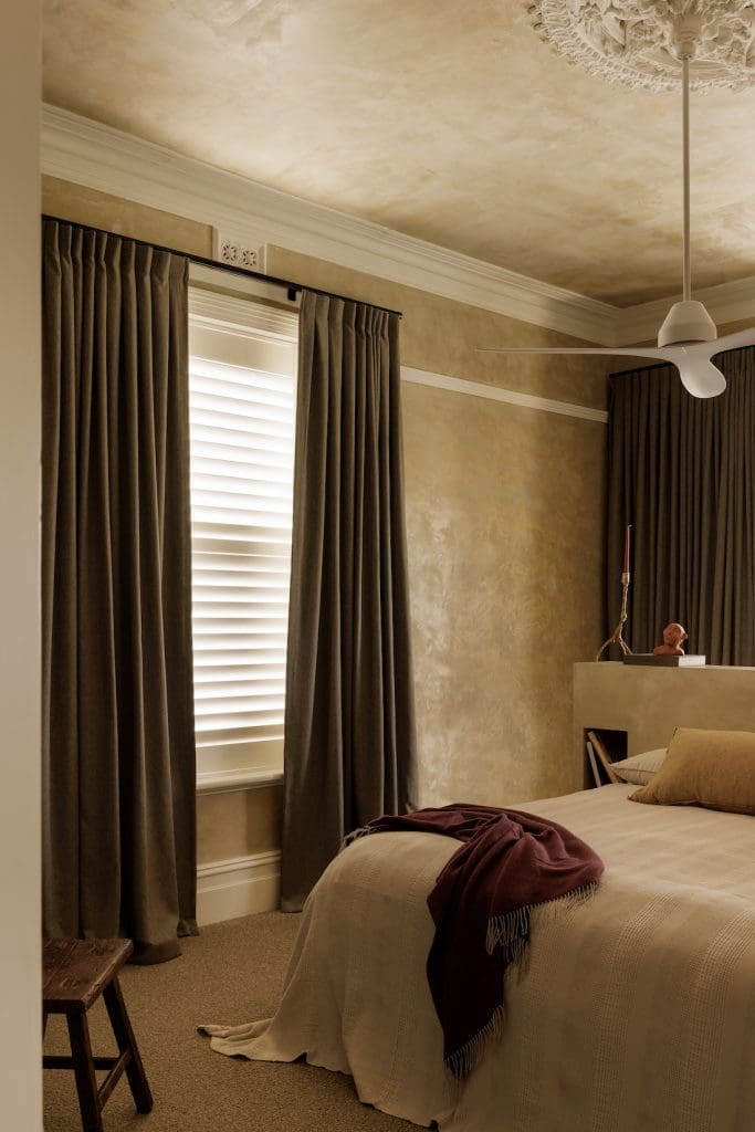 Bedroom with ornate ceiling rose at Coastal Alchemy by The Stylesmiths