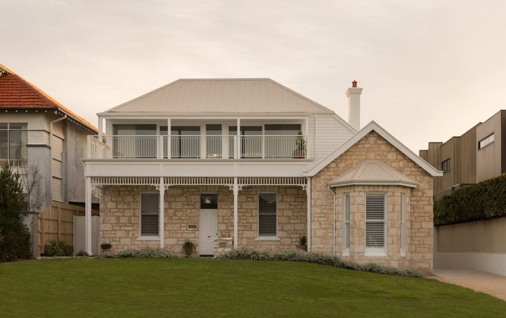 Exterior of limestone home Coastal Alchemy by The Stylesmiths