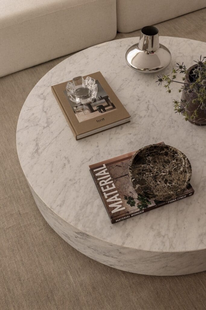 Coffee table flat lay styling details in living room of Deakin Home