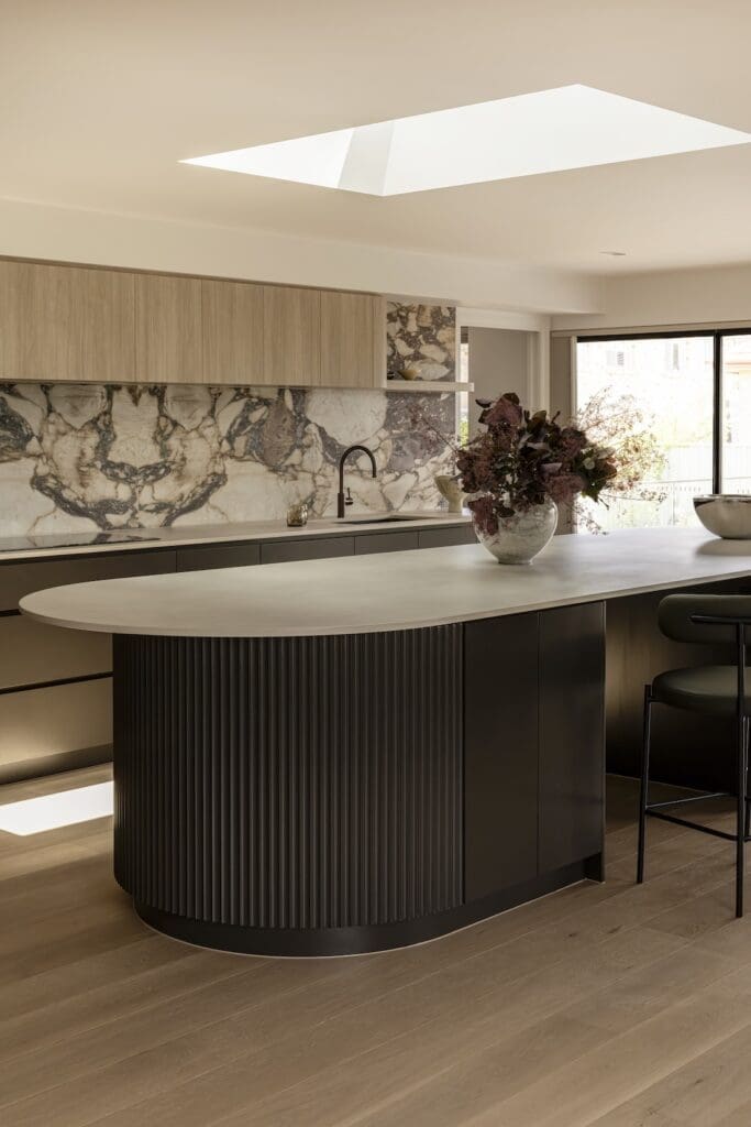 Curved island bench in kitchen of Deakin Home