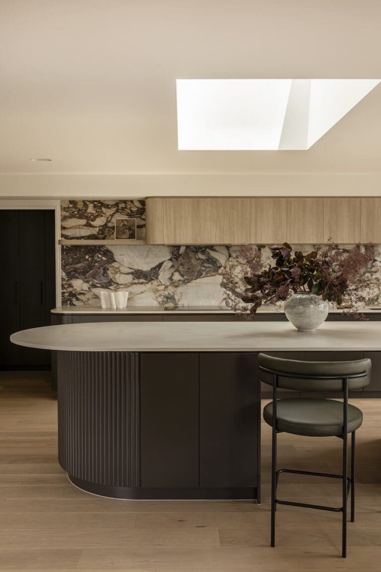 Kitchen with curved island bench and skylight in Deakin Home