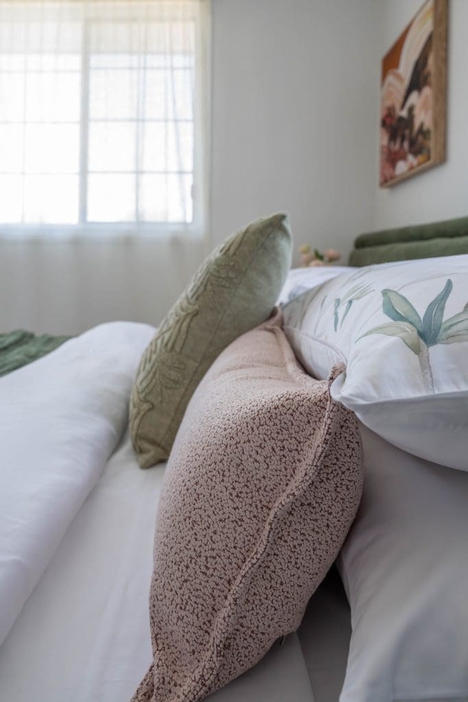 Close up of pink and green cushions